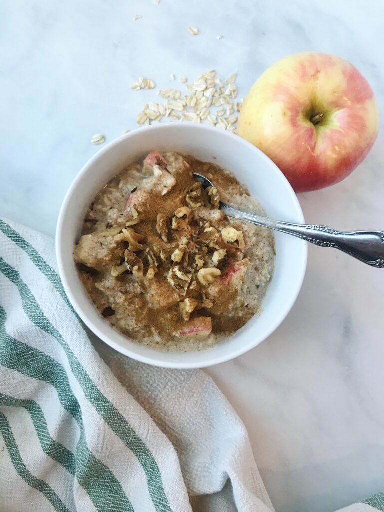Bowl of apple cinnamon overnight oats with spoon
