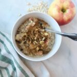 Bowl of apple cinnamon overnight oats with spoon