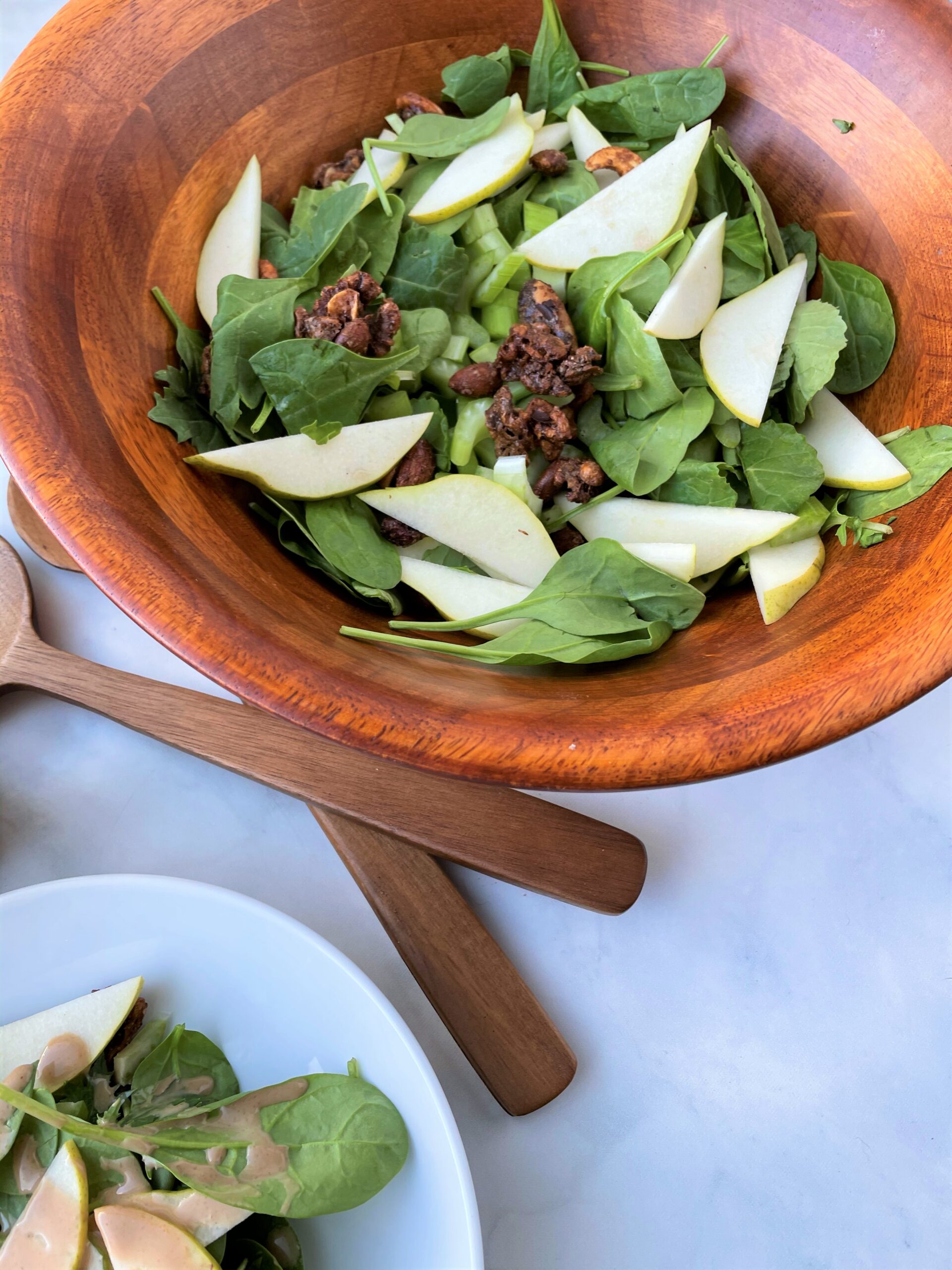 bowl of a delicious holiday salad with a creamy balsamic vinegar dressing